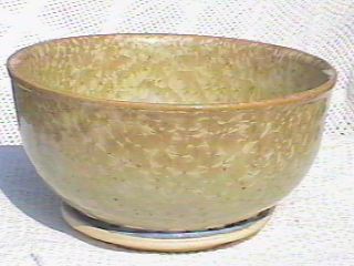 Big stoneware bowl covered with blond crystals